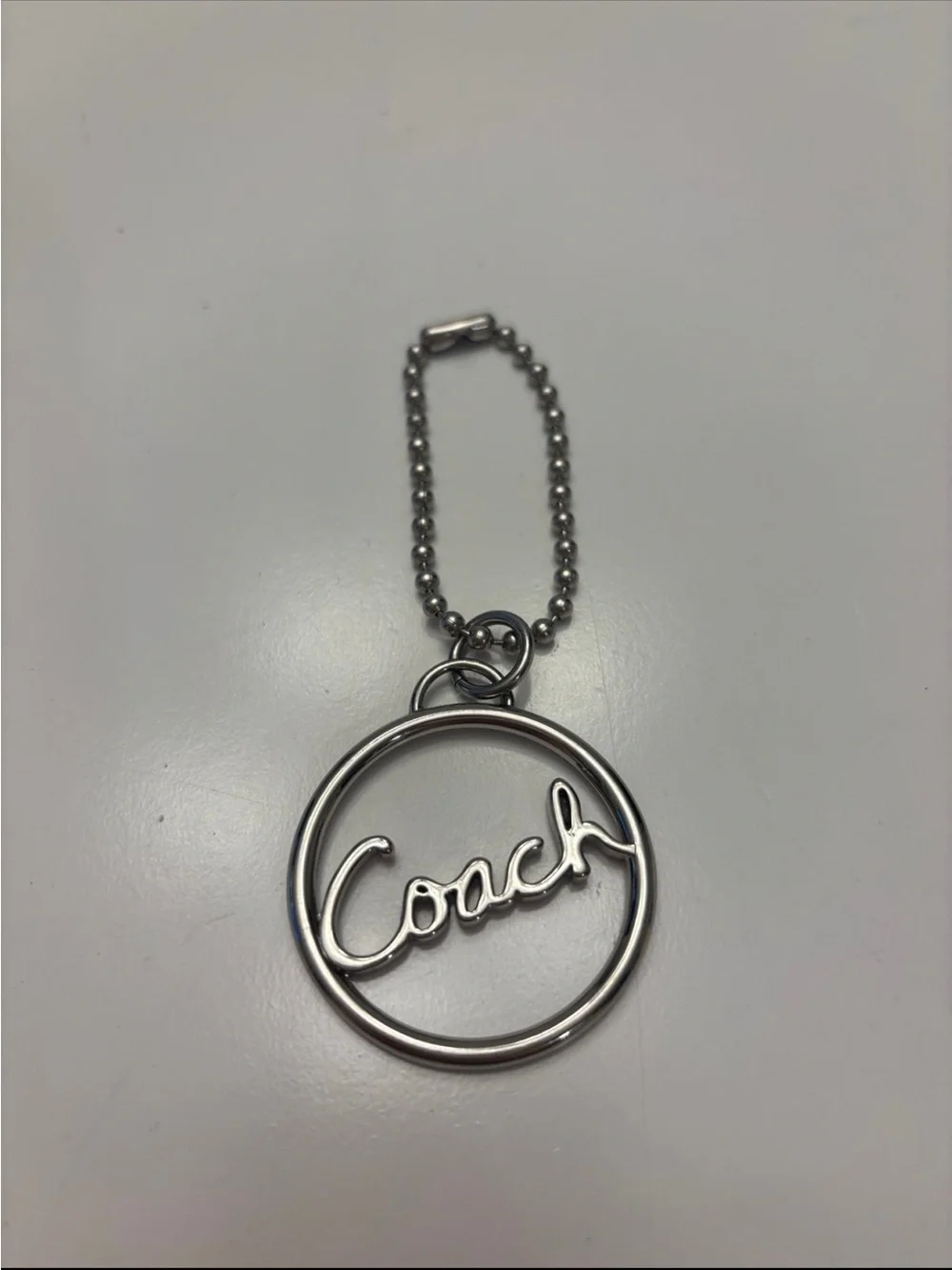Coach Silver Script Circle Keychain